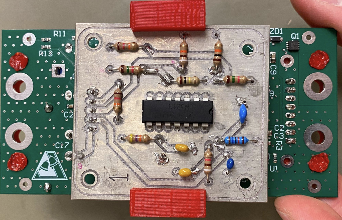 Current-sensing PCB mounted on the power supply assembly.